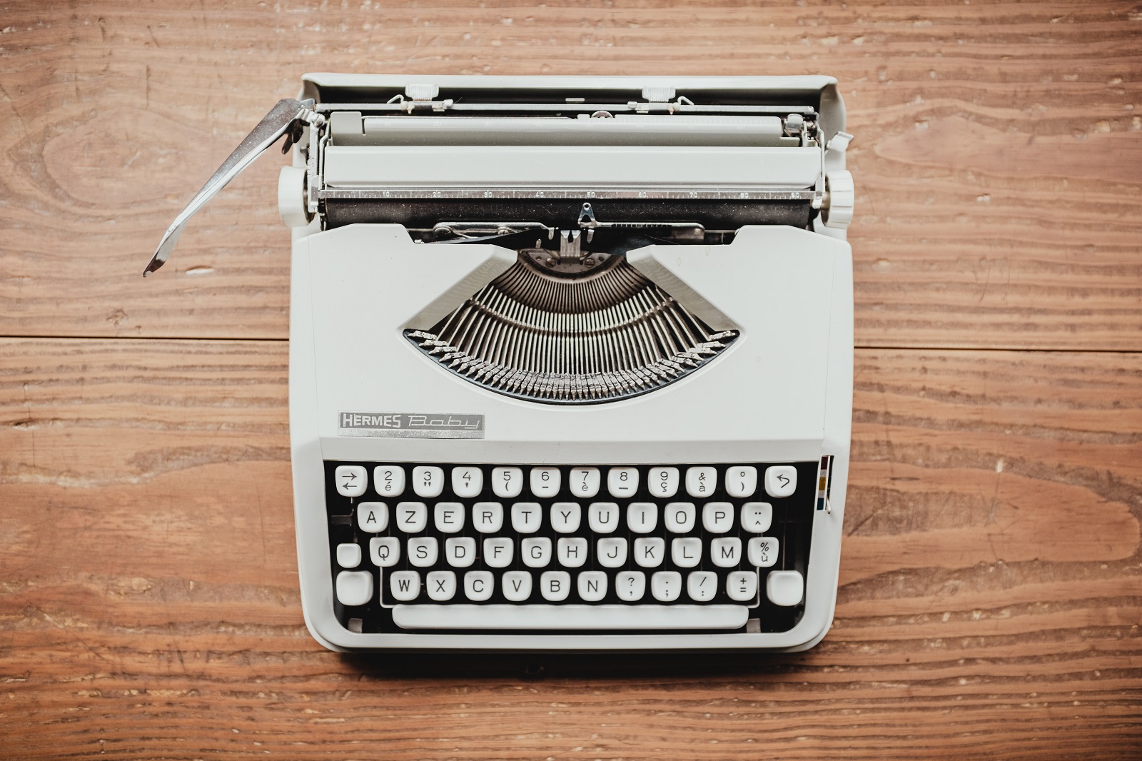 typewriter on a wood grain background